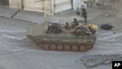 A Syrian army tank is seen in the Zabadani neighborhood of Damascus (file photo)